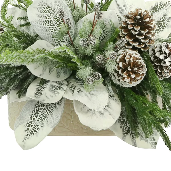 Magnolia Leaf Holiday Arrangement with Pinecones in an Oval Ceramic Pot