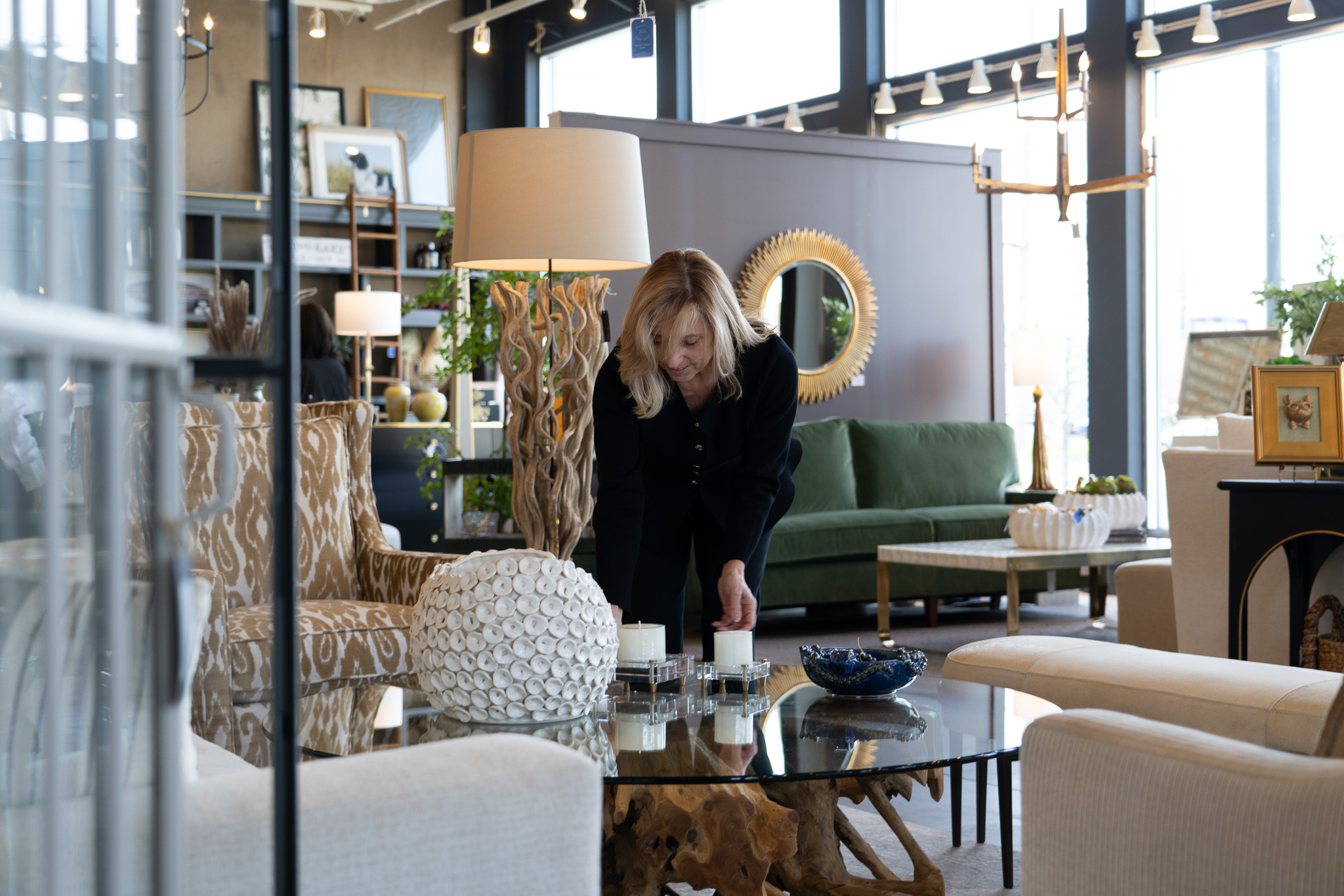 Interior designer arranging decor inside NJ furniture showroom
